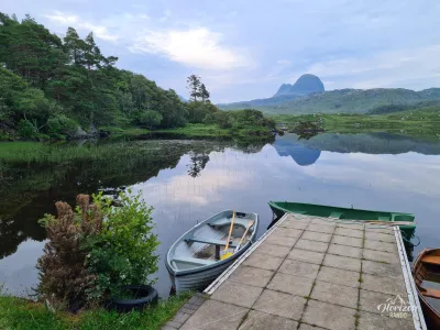 Loch Druim Suardalain et la silhoutte de Suilven en arrière plan Loch Druim Suardalain et la silhoutte de Suilven en arrière plan
